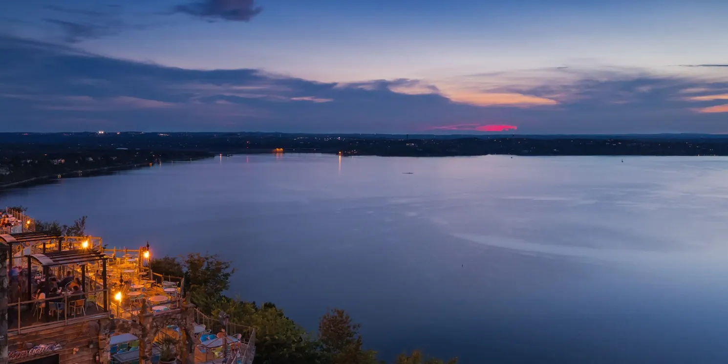 Lakeside restaurant patio on Lake Travis at dusk